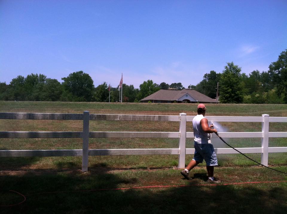 Man cleaning wooden fence — Morrilton, AR — Chadek Power Wash