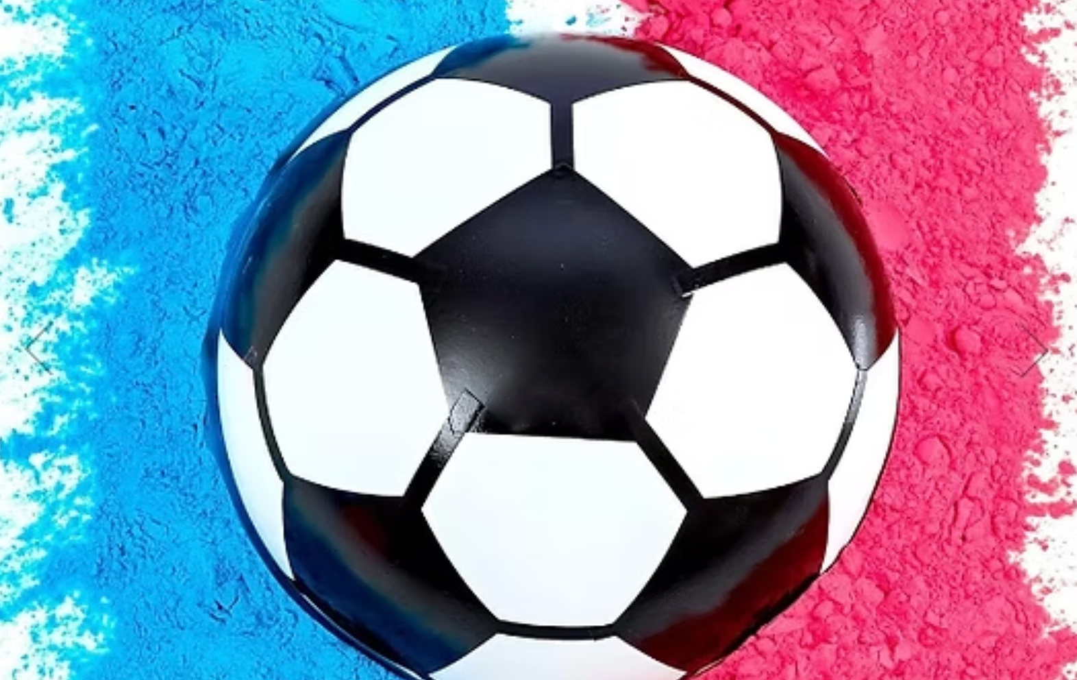 Black-and-white soccer ball on blue and pink painted background