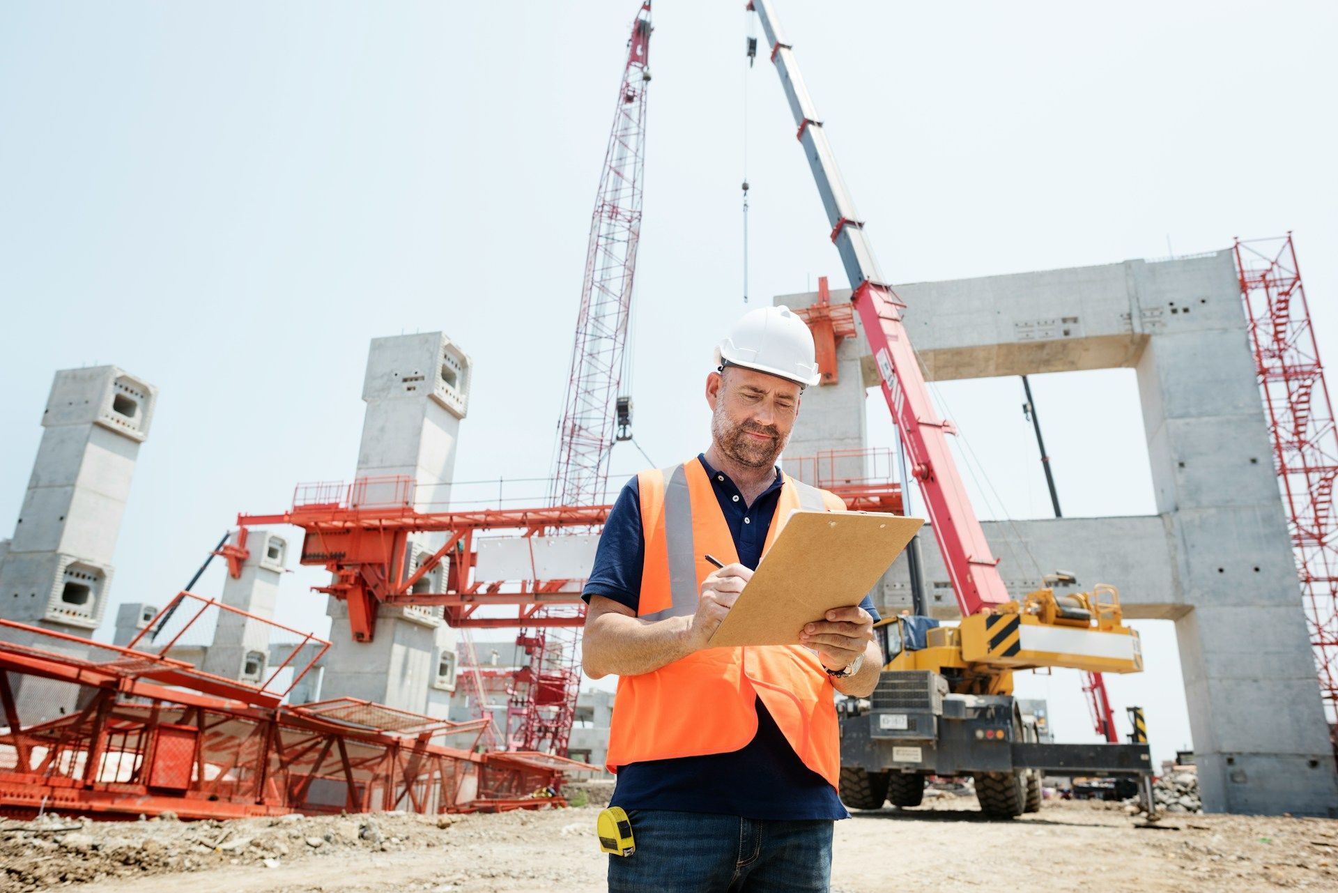 Foreman on a construction site with a crane in the background