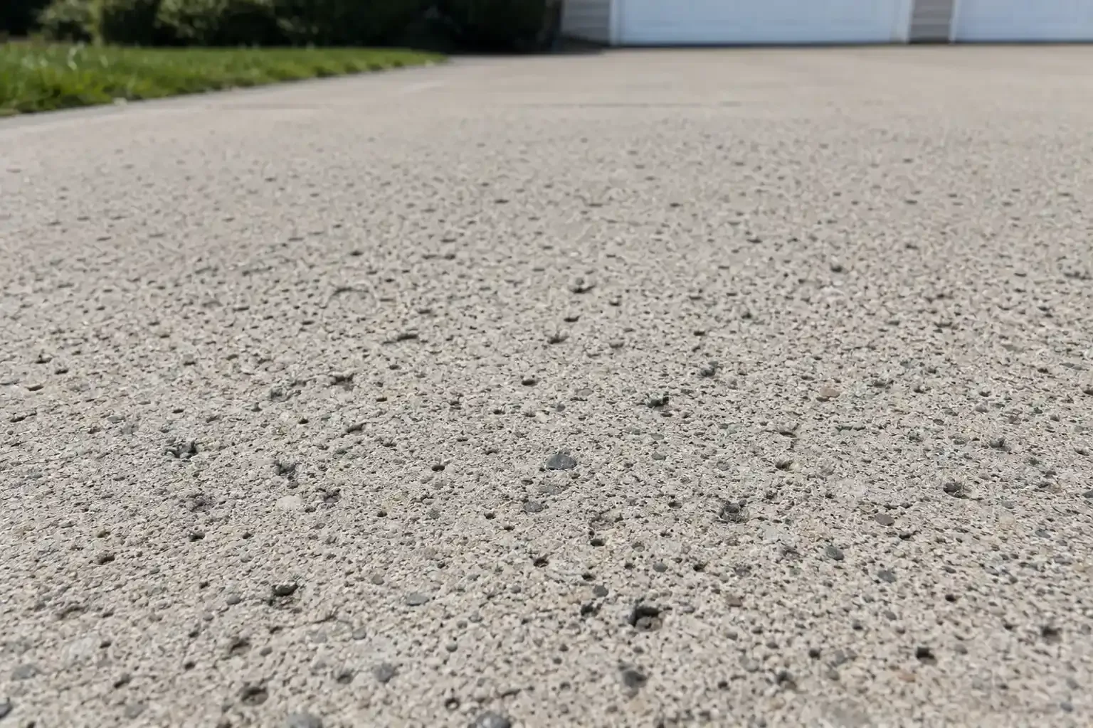 Concrete driveway with holes in the concrete