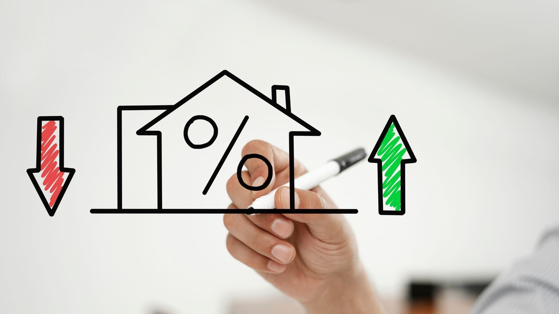A person is drawing a graph of a house , percentage , and arrows.