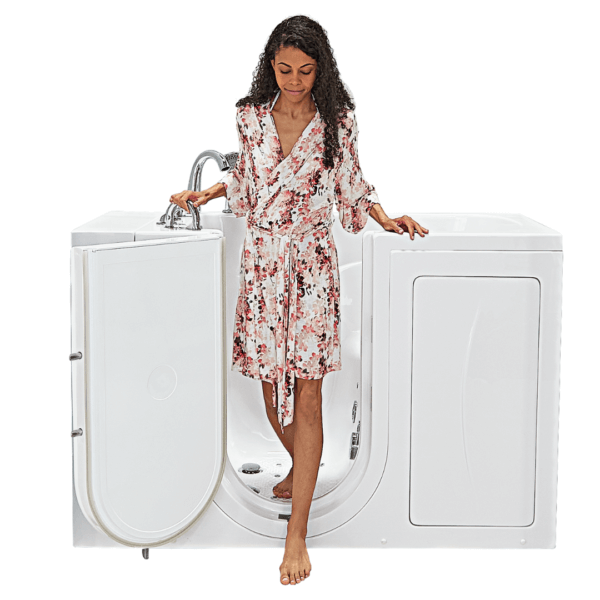A woman is standing in a walk in tub with the door open.