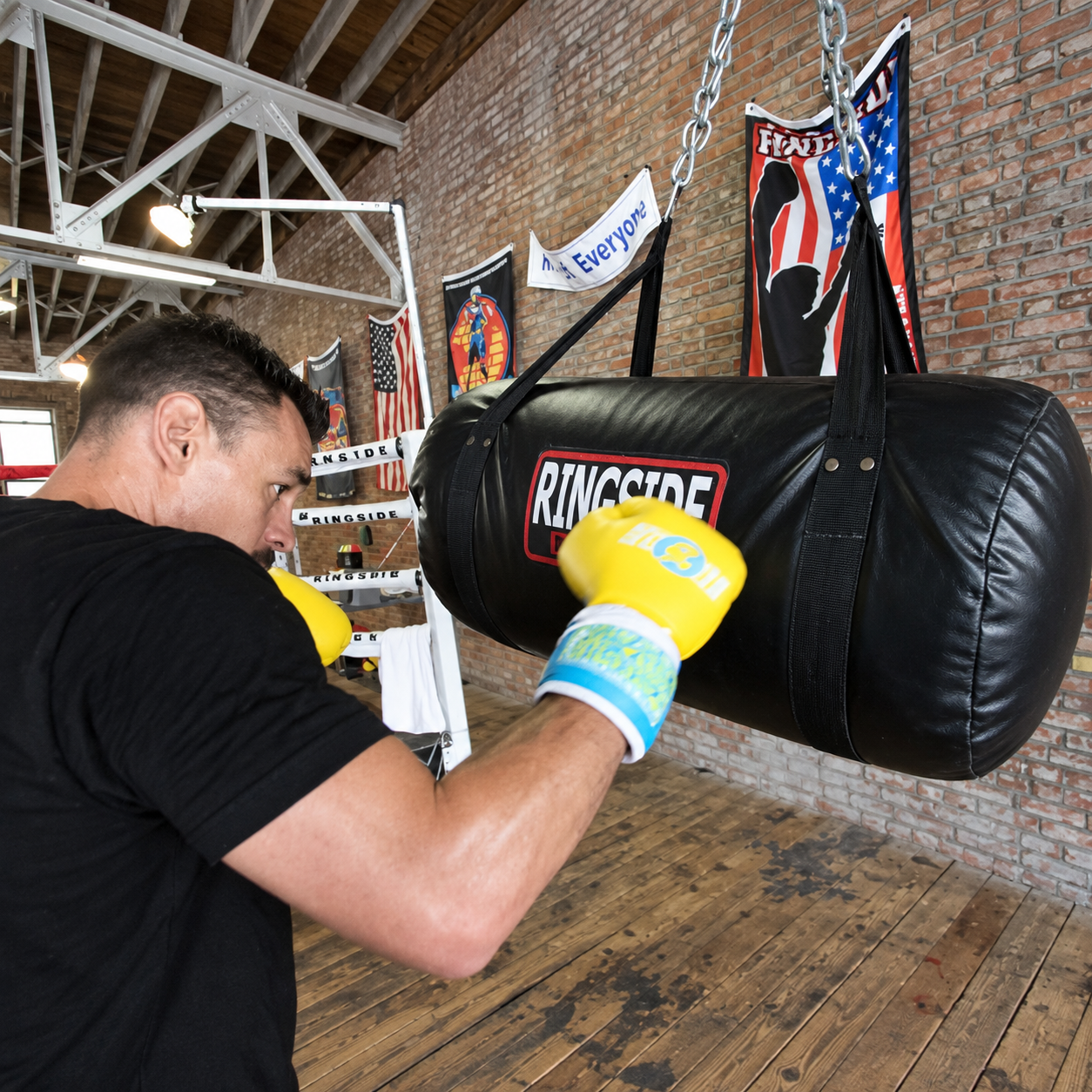 Boxer training with heavy bag in a professional boxing gym
