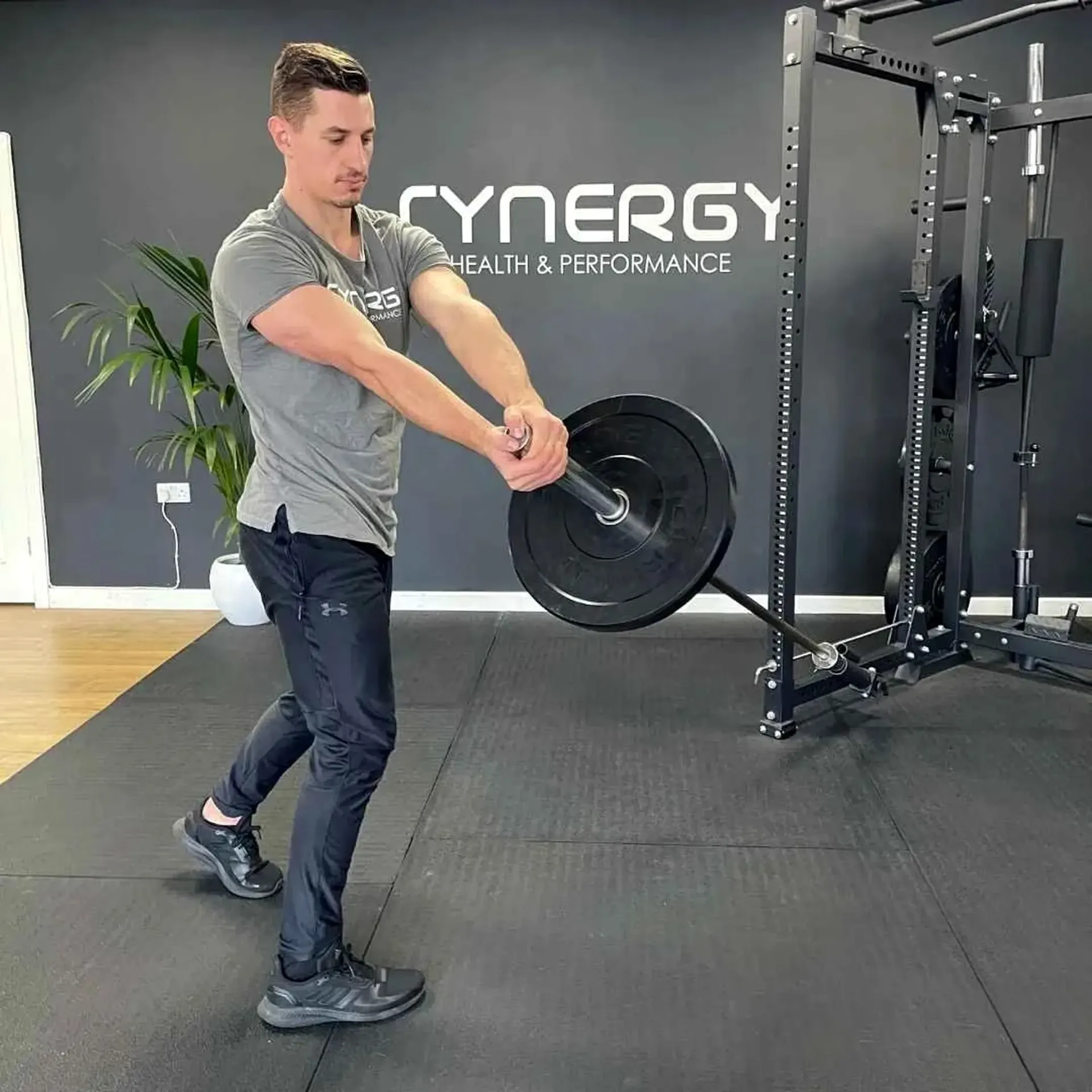 Athlete performing landmine rotations to build rotational strength for boxing power.