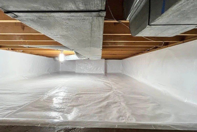 Plastic-covered basement with exposed beams and ducts, lit by a single bulb