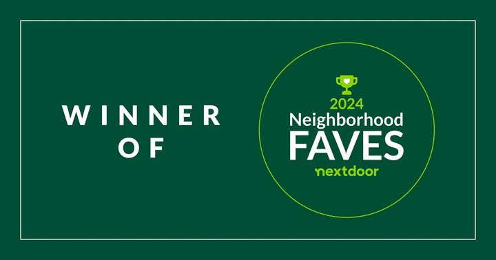 A green sign that says winner of neighborhood faves next door