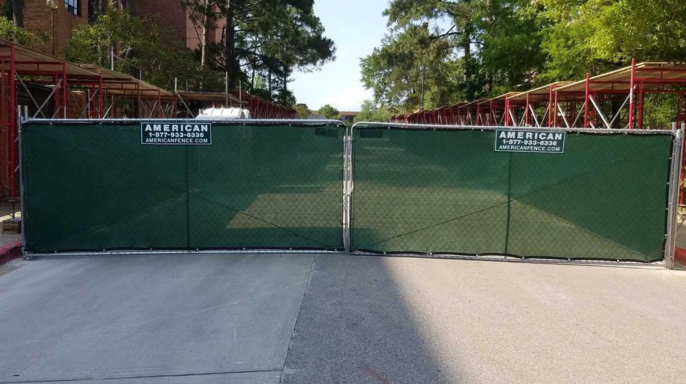 A green fence with the word american on it