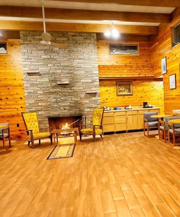 There is a fireplace in the middle of the room.
