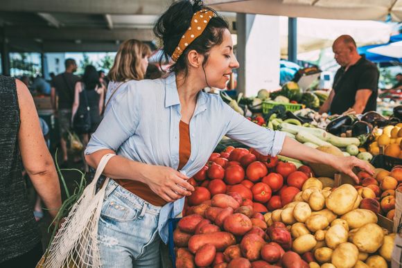Lady Picking Fruits on Stand — Pine City, MN — More Than Sprouts, Sprouted Branch and Sprouting Out Store