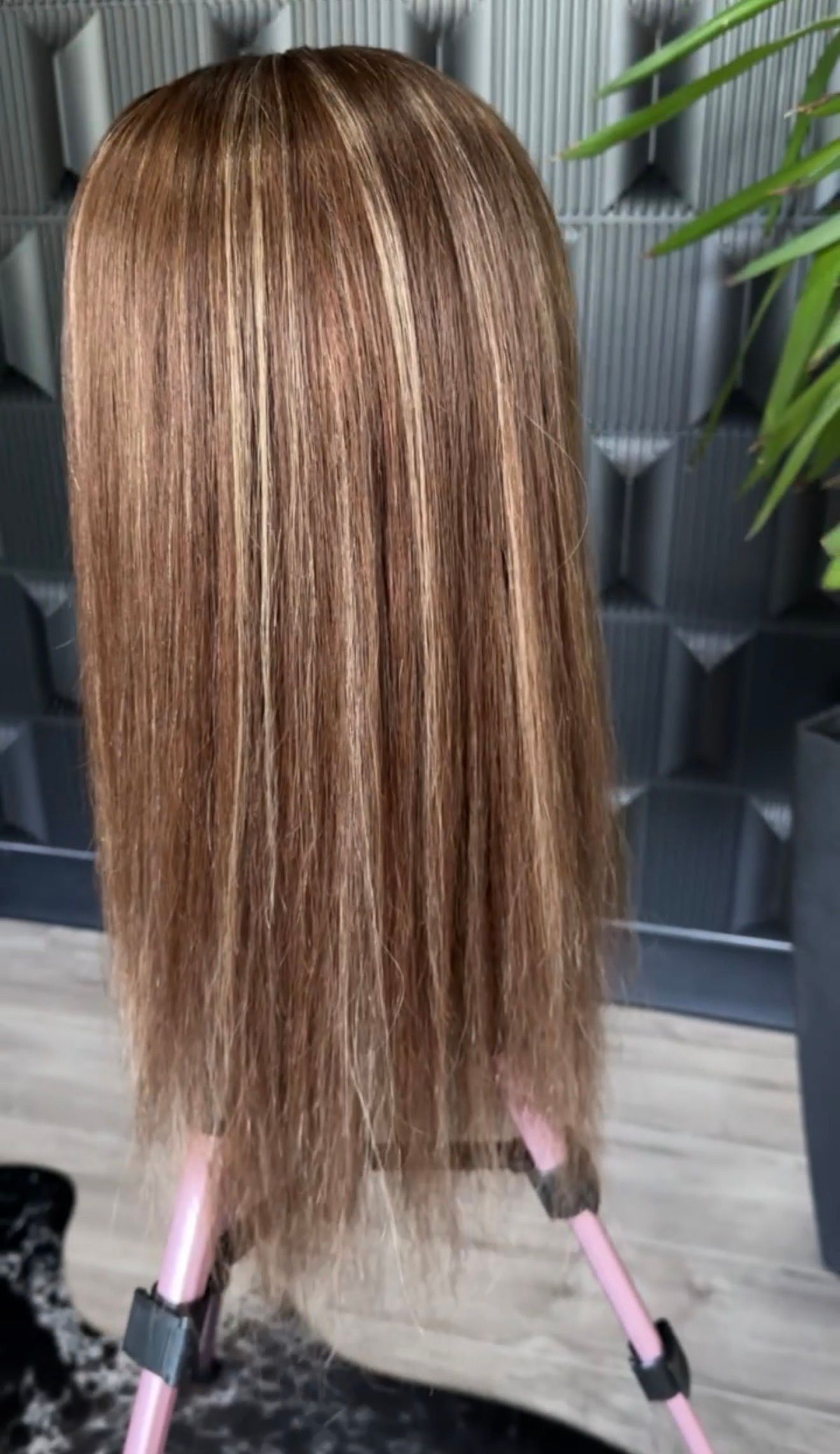 Back view of a custom wig created to resemble a client's natural hair