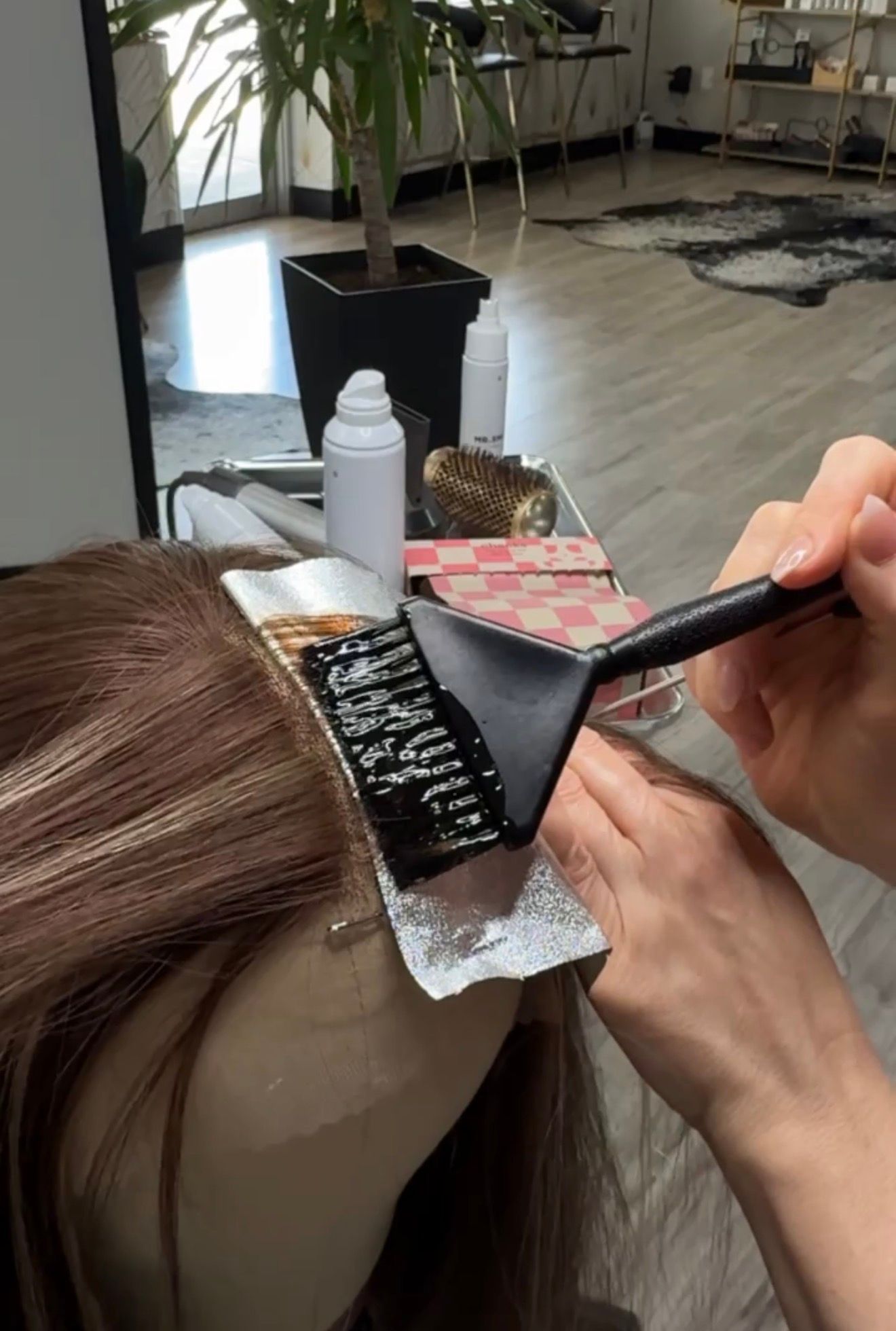 Custom coloring a medical wig to recreate a client's natural hair color