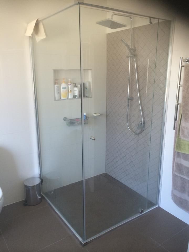 A Bathroom with A Walk in Shower with A Glass Door — Distinctive Glass & Aluminium in Port Kembla, NSW