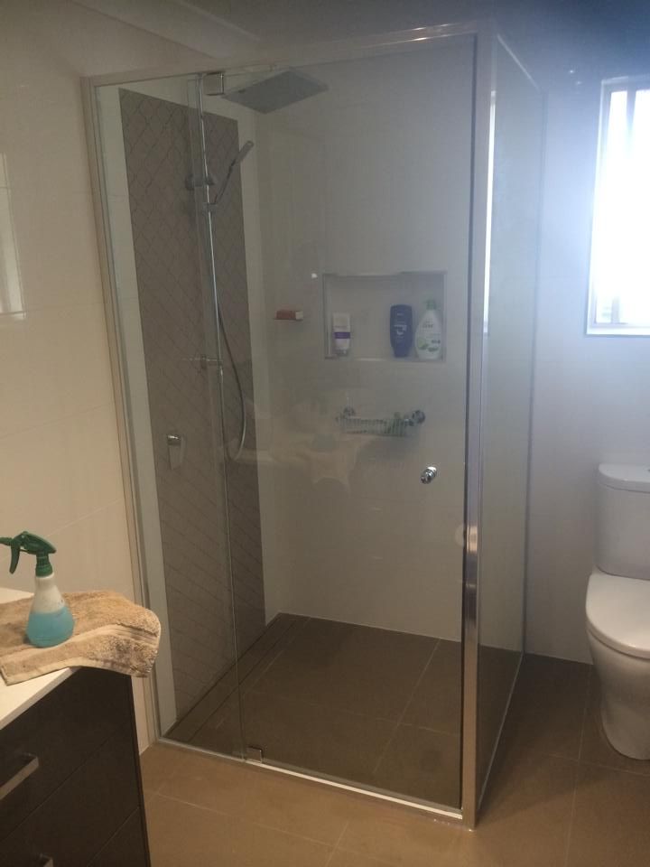 A Bathroom with A Walk in Shower, Toilet and Sink — Distinctive Glass & Aluminium in Port Kembla, NSW