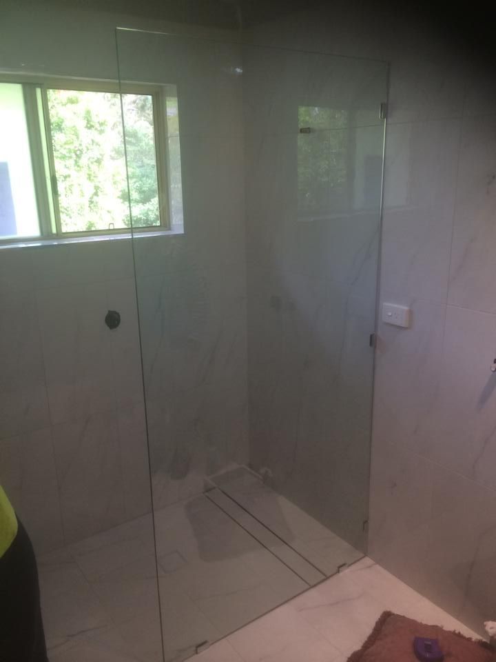 A Bathroom with A Walk in Shower and A Window — Distinctive Glass & Aluminium in Port Kembla, NSW