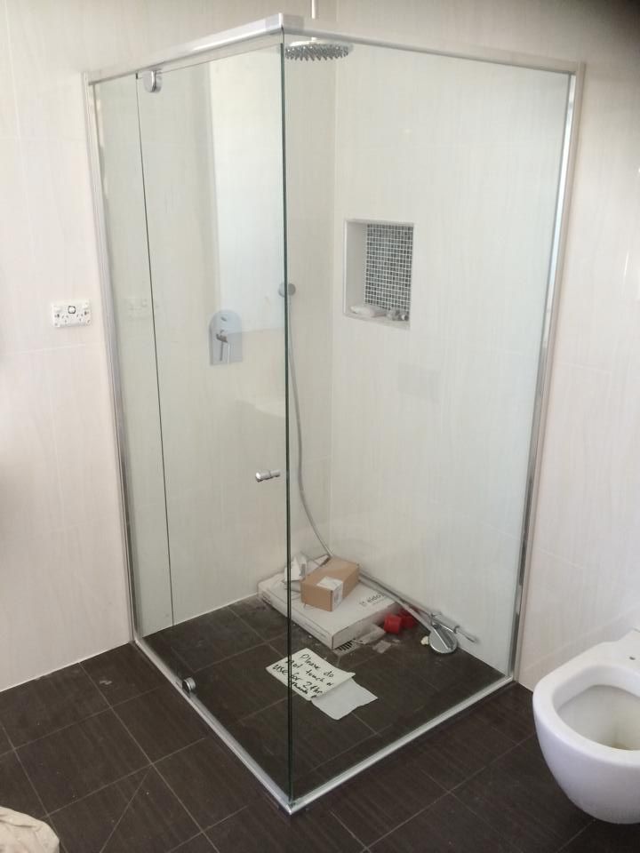A Bathroom with A Walk in Shower and A Toilet — Distinctive Glass & Aluminium in Port Kembla, NSW