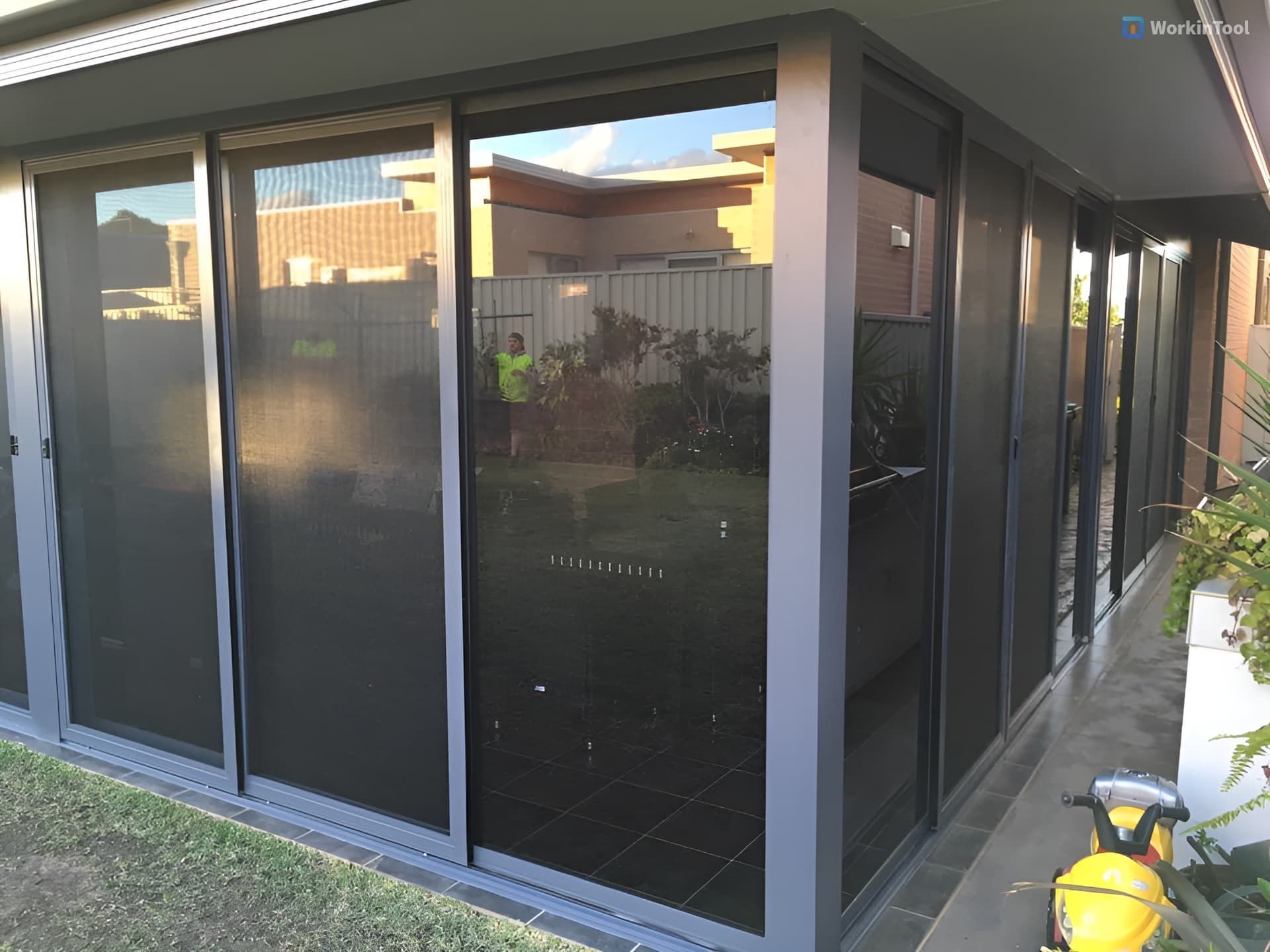 A House with A Sliding Glass Door and A Brick Wall — Distinctive Glass & Aluminium in Port Kembla, NSW