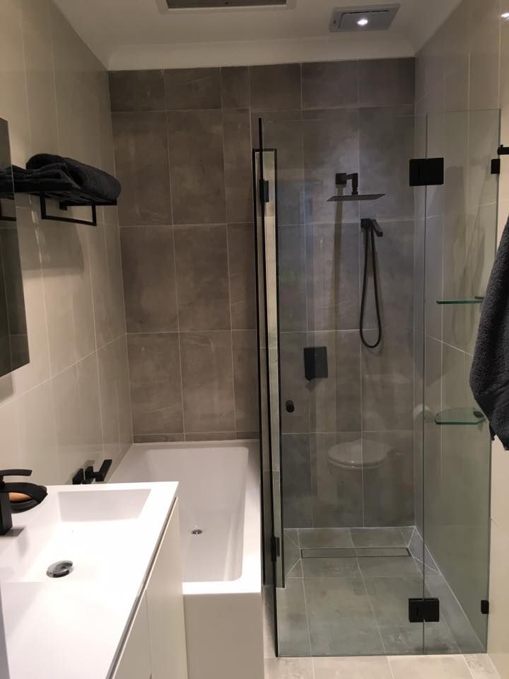 A Bathroom with A Bathtub, Sink and Shower — Distinctive Glass & Aluminium in Port Kembla, NSW
