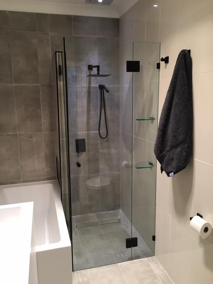 A Bathroom with A Walk in Shower and A Bathtub — Distinctive Glass & Aluminium in Shellharbour, NSW