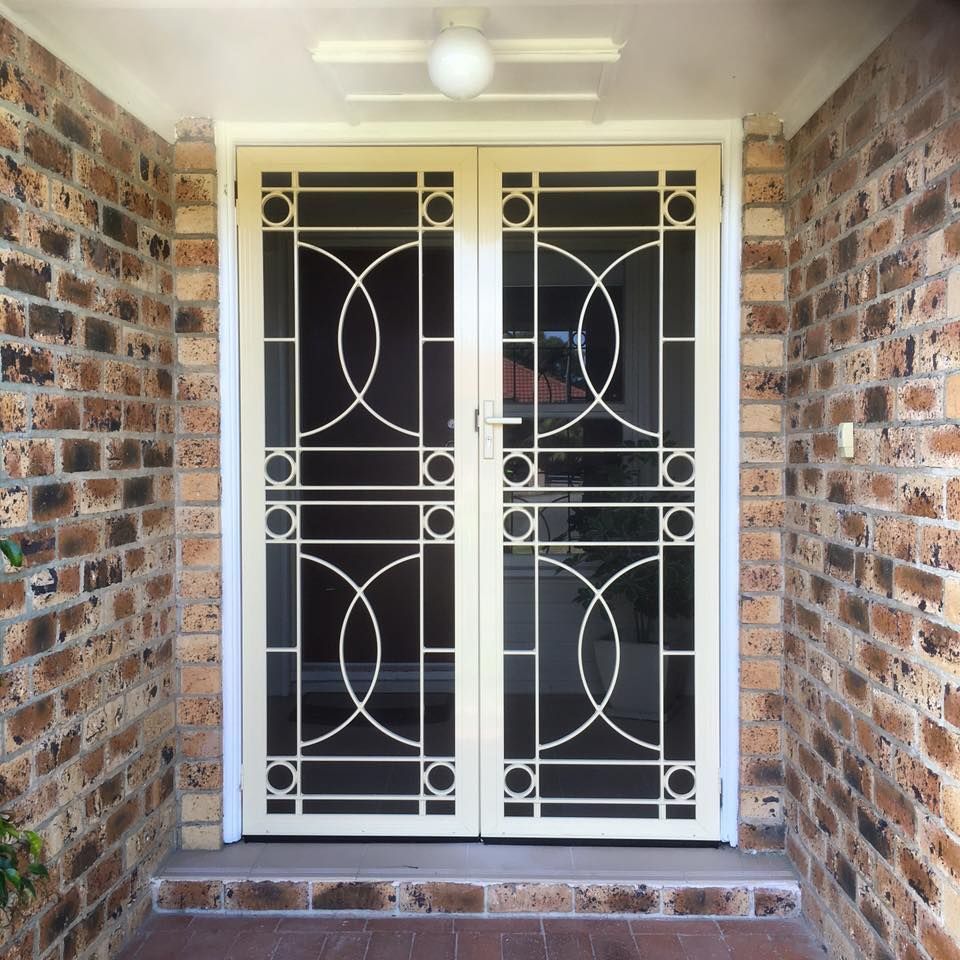A Brick Wall with Security Door — Distinctive Glass & Aluminium in Port Kembla, NSW
