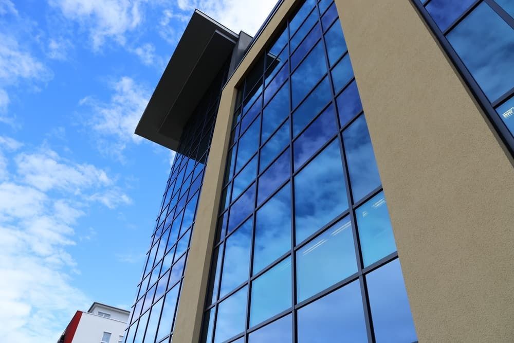 Looking up At a Tall Building with Lots of Windows — Distinctive Glass & Aluminium in Albion Park, NSW