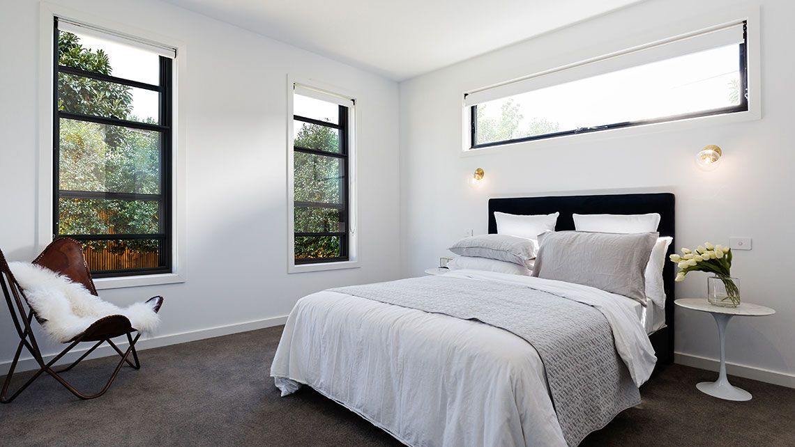 A Bedroom with A Bed and Two Windows — Distinctive Glass & Aluminium in Port Kembla, NSW