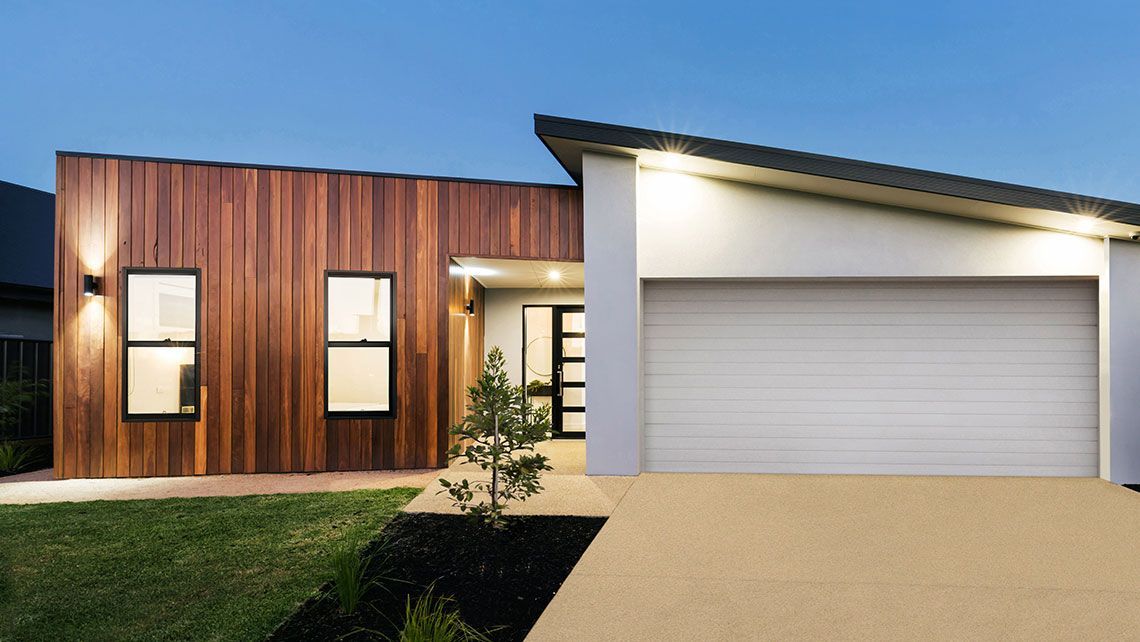 A Modern House with A Wooden Facade — Distinctive Glass & Aluminium in Port Kembla, NSW
