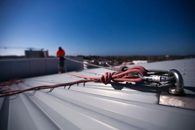 Roof anchor point and safety line on a rooftop