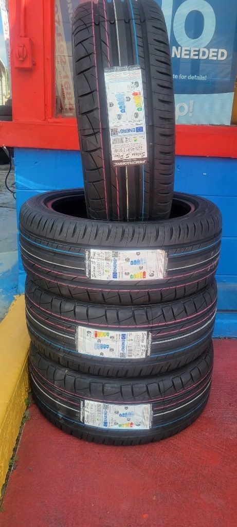 A stack of tires sitting on top of each other on a red carpet.