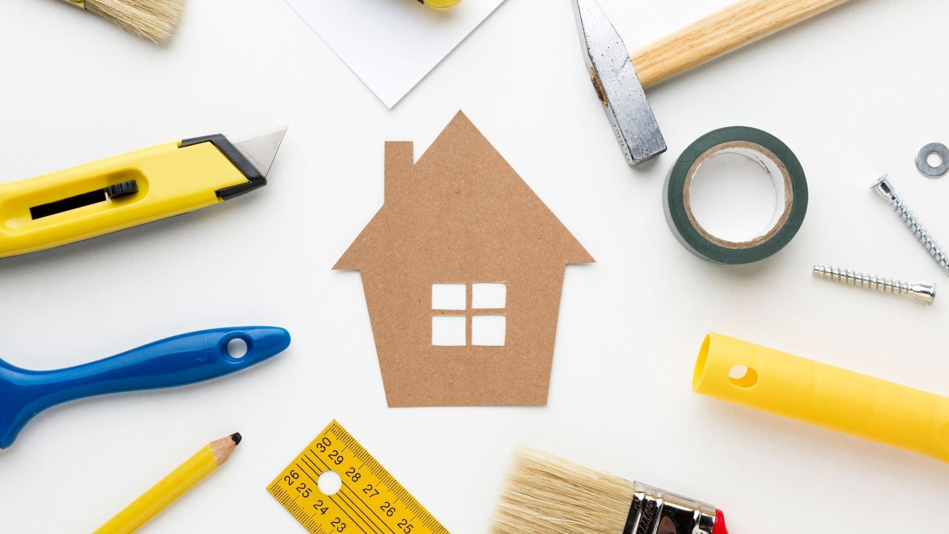 Home icon surrounded by yellow and blue tools on a white background