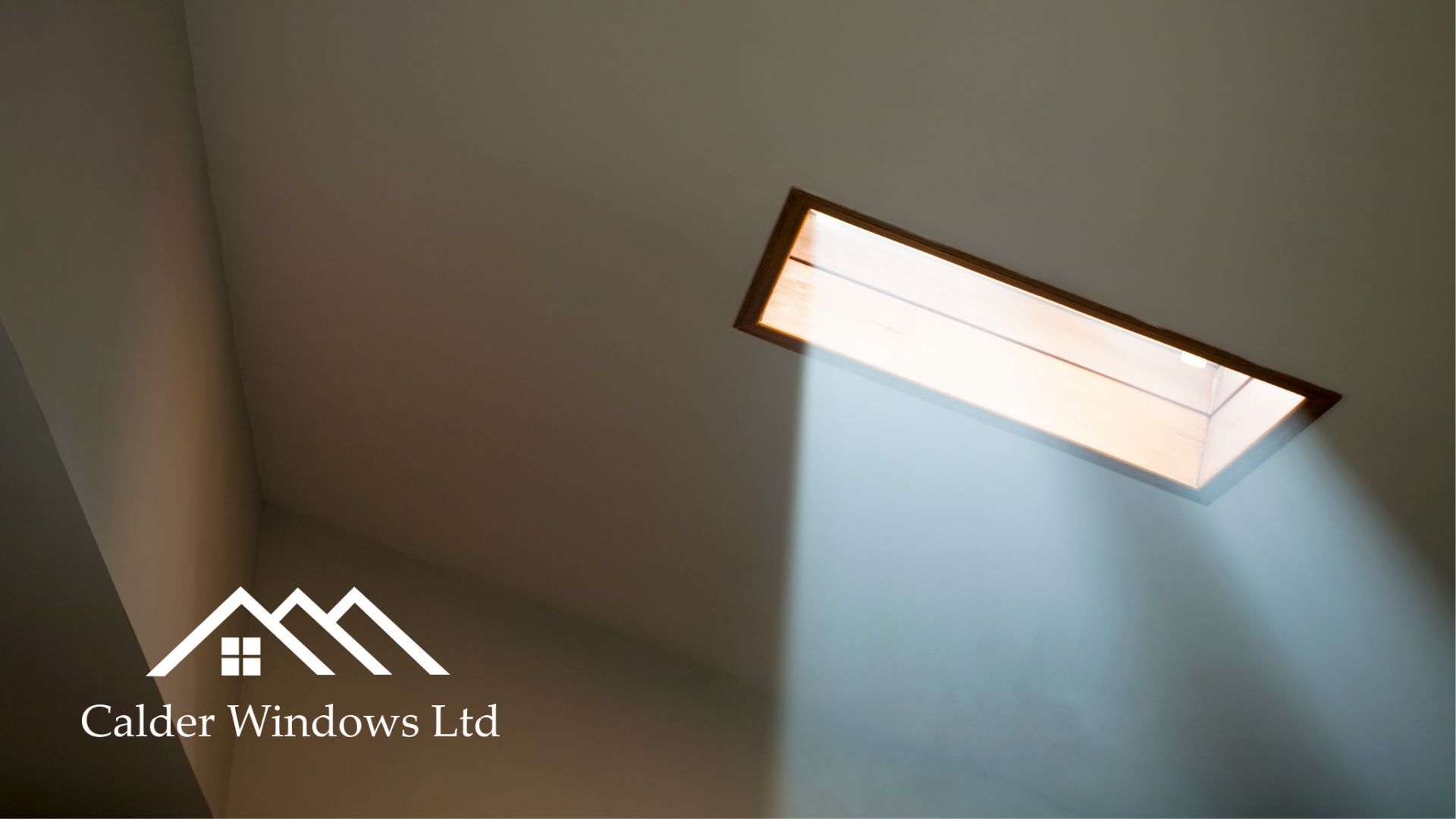 Skylight in a ceiling casting sunlight into a room with a Calibre Windows Ltd logo watermark