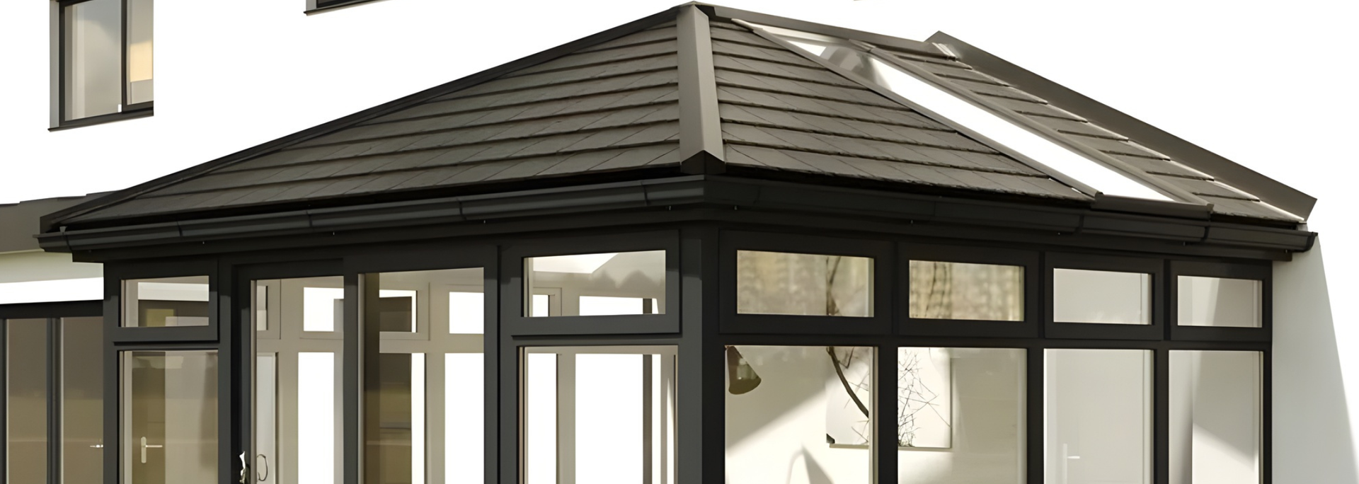 Modern house conservatory with dark-framed windows and a shingled roof