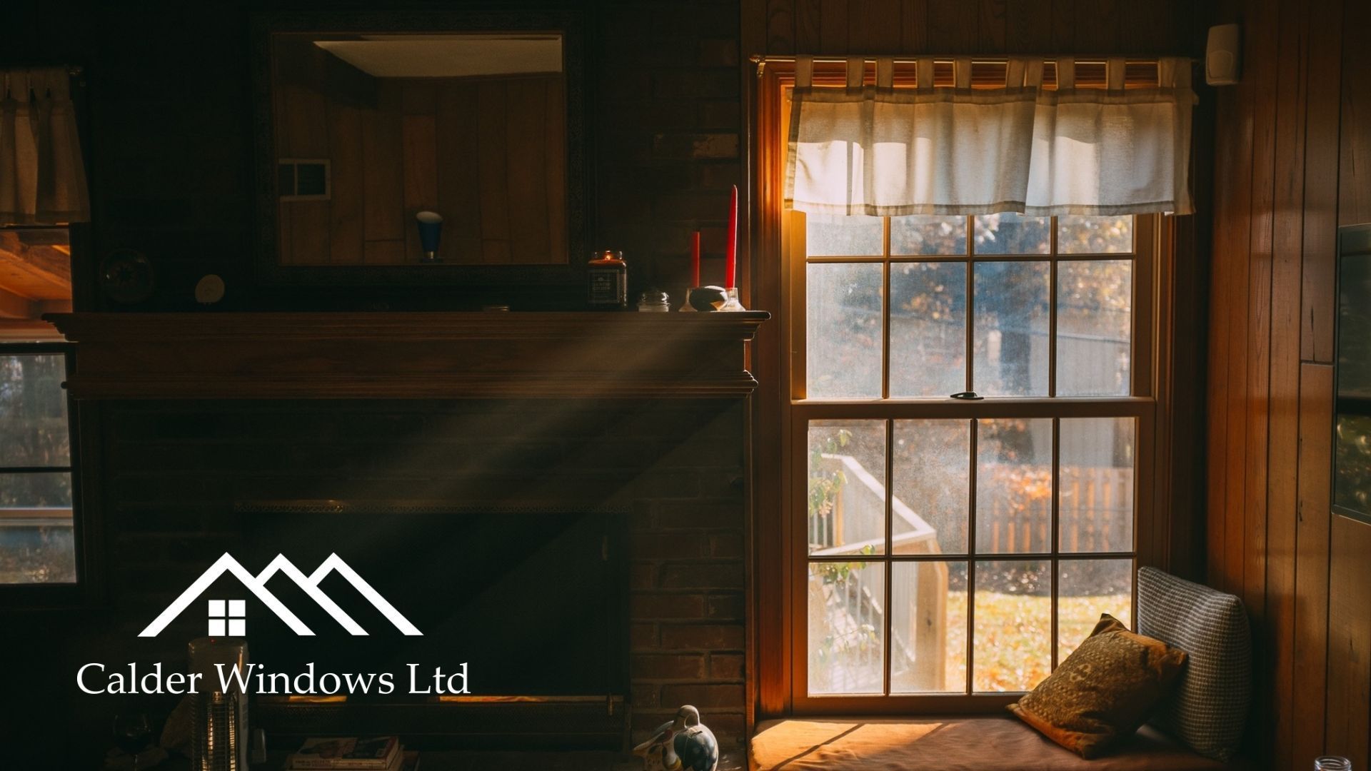 Cozy wooden cabin interior with a sunlit window, bed, and fireplace, branded “Calder Windows Ltd.”