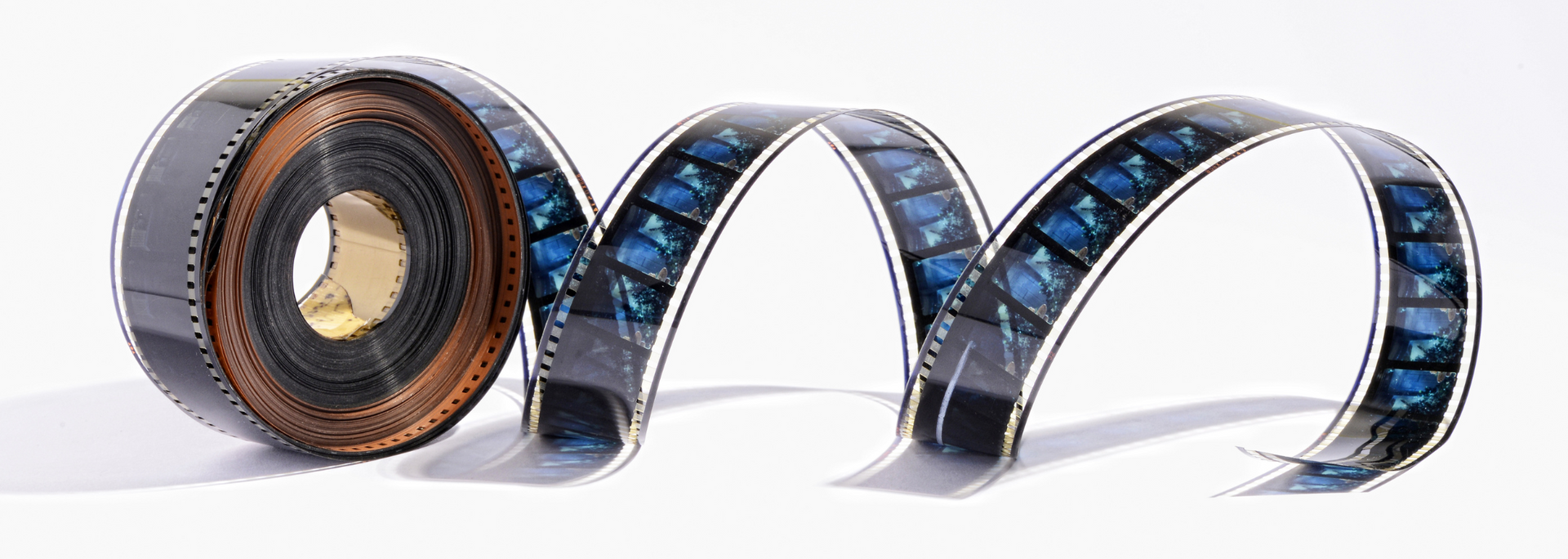 Blue and copper coiled metallic ribbon forming a looped tunnel on a white background