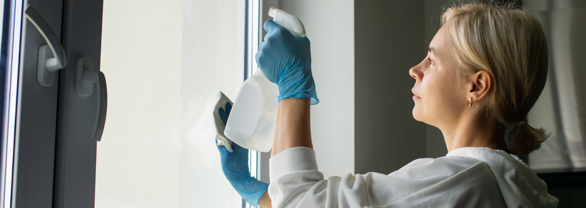 Picture of someone cleaning a window. Picture of someone cleaning a window.