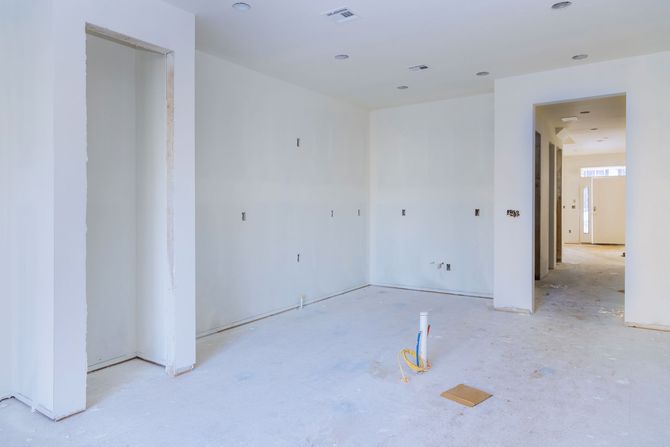 Home theater with a large screen, wooden ceiling, and football game playing.