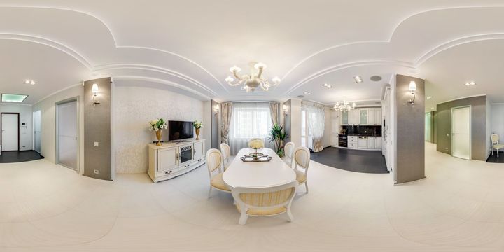 Interior room with drywall installation; walls and ceiling are grey with white joint compound.