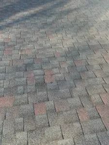 Gray and pink brick pavement with a faint shadow pattern