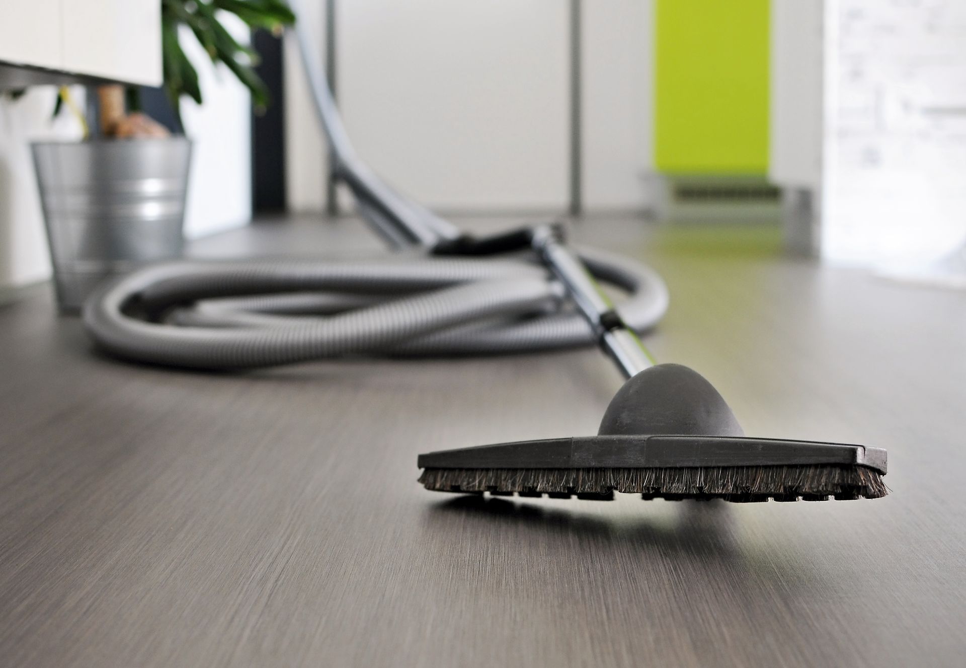 A Vacuum Cleaner Is Sitting on A Wooden Floor