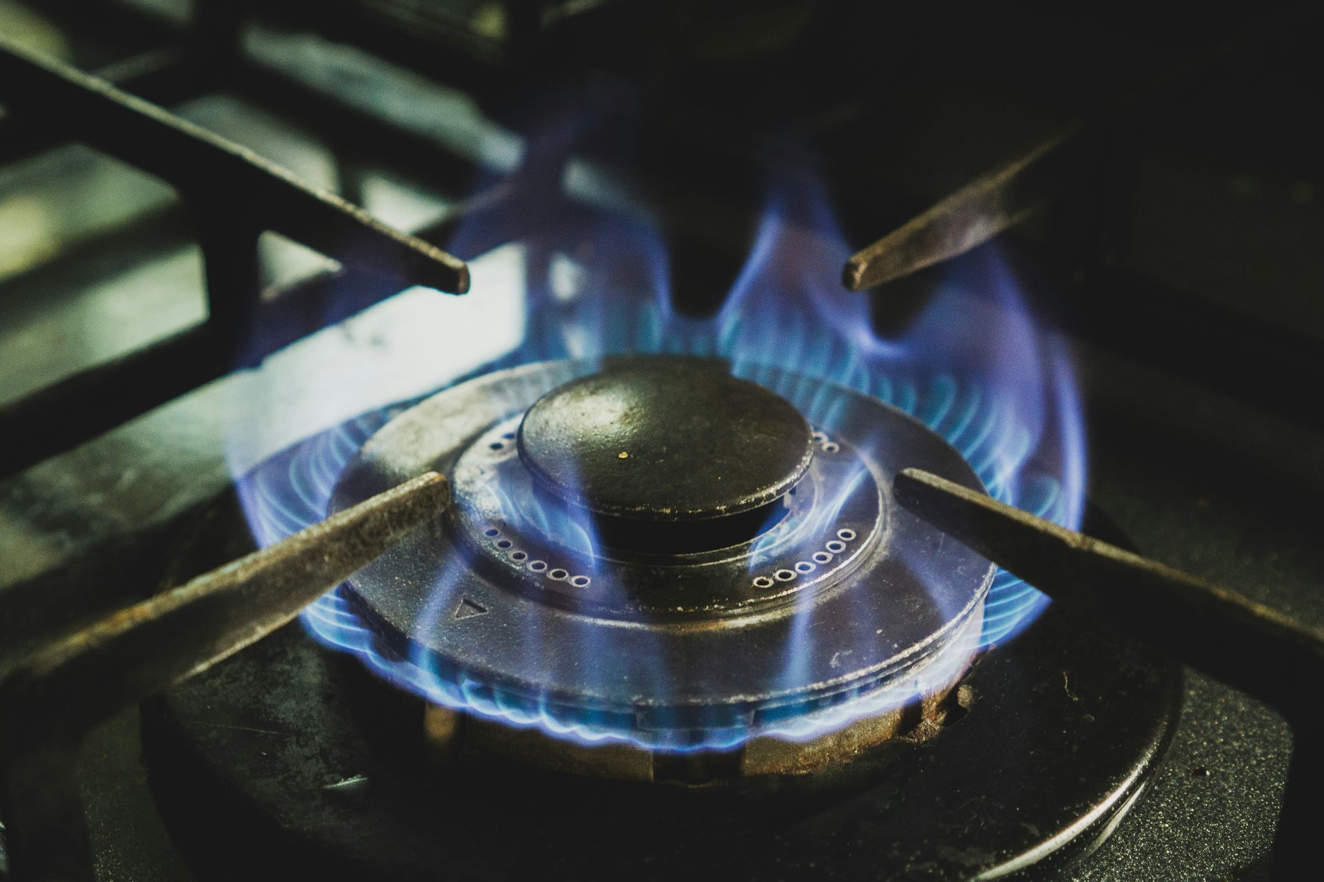 close up of a gas stove top that indicated Avid plumbing can install gas lines