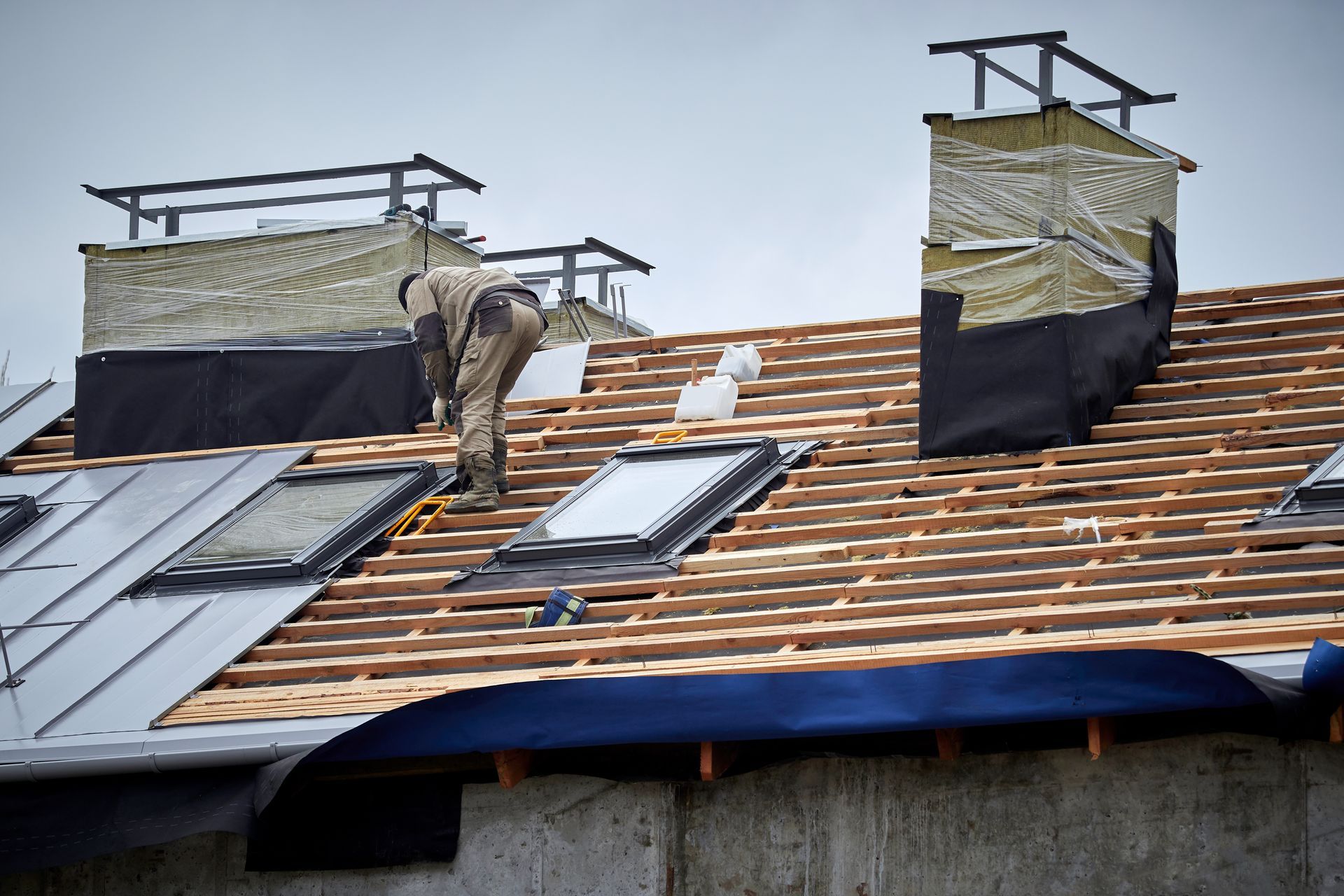 contractor installing a fixed skylight