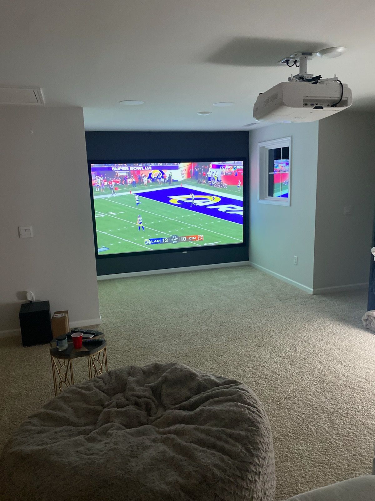 TV Mounted on a white brick wall