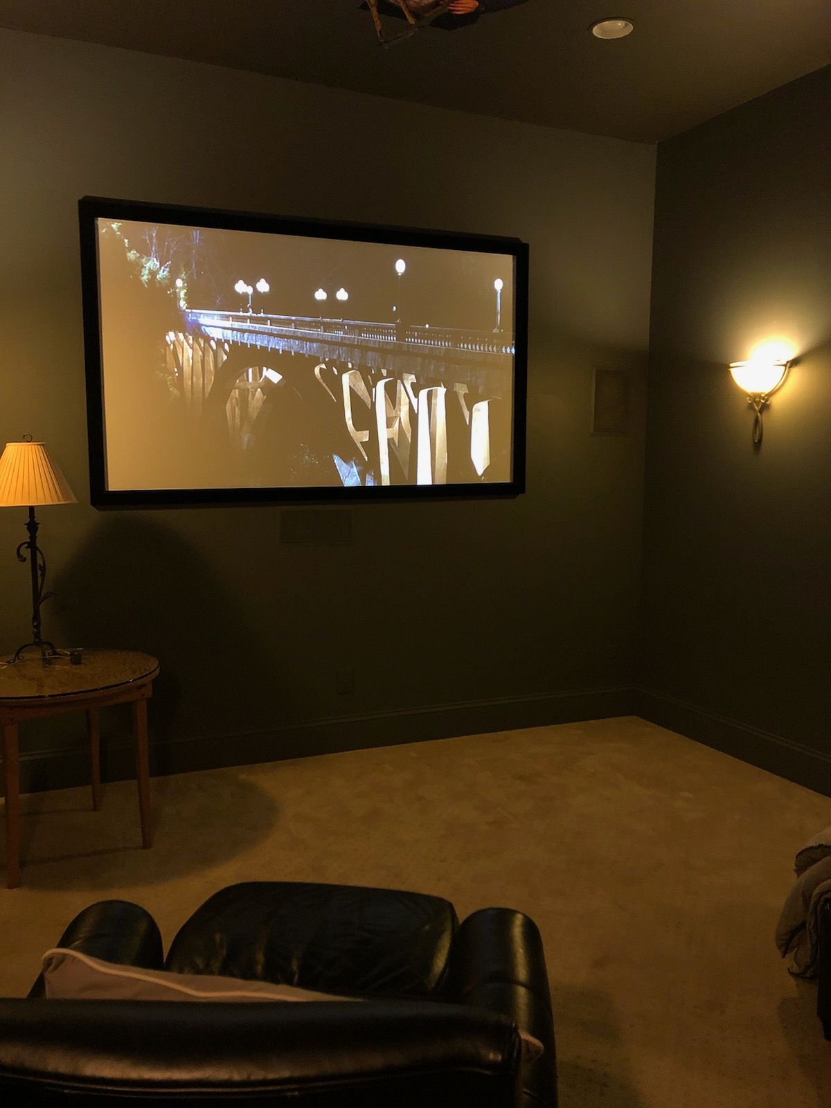 Outdoor TV Mounting over fireplace mantel on stone wall outside on a patio