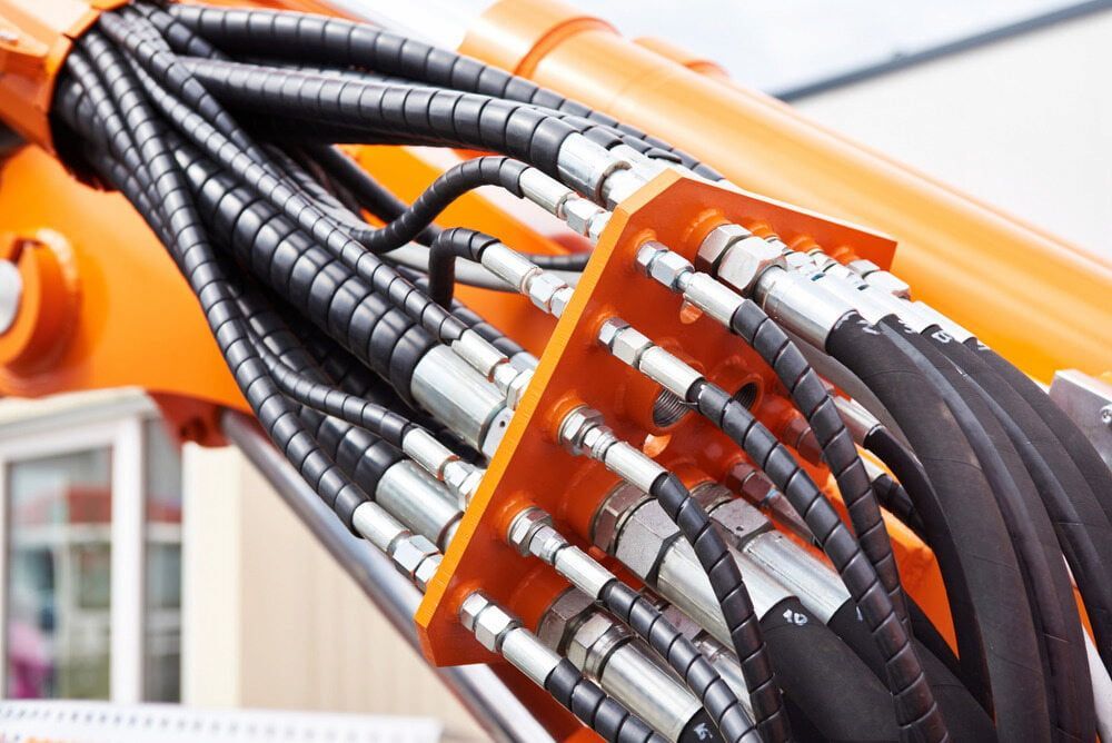 A Bunch Of Hydraulic Hoses Are Attached To A Machine — Figtree Brake and Clutch in Figtree, NSW