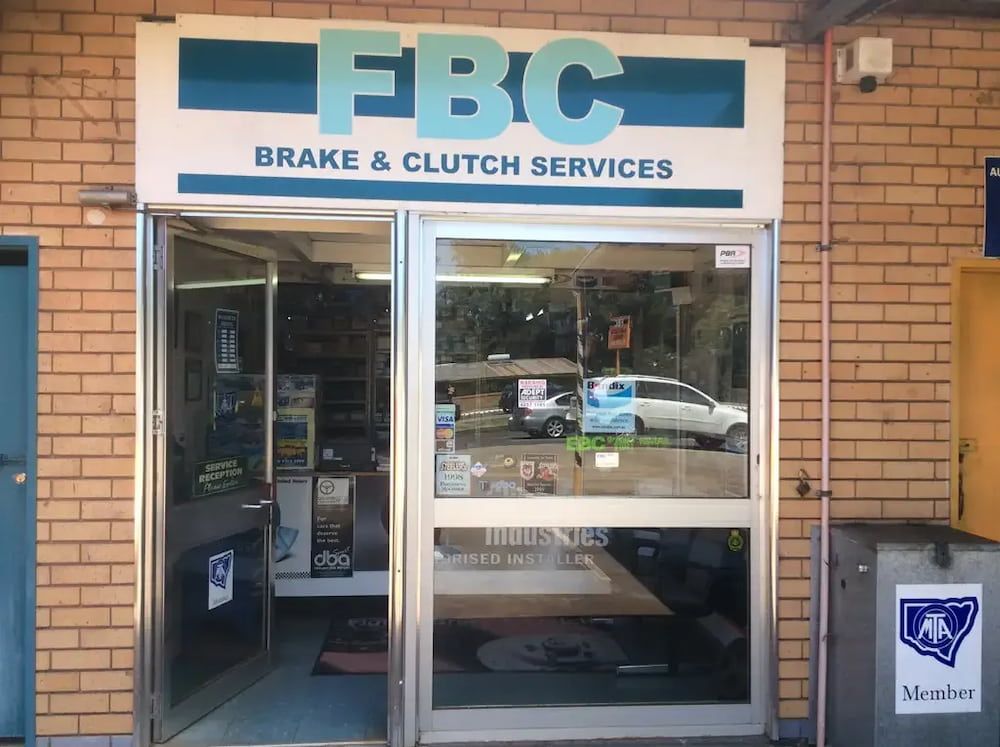 A Brick Building With A Sign That Says FBC Brake & Clutch Services — Figtree Brake and Clutch in Figtree, NSW