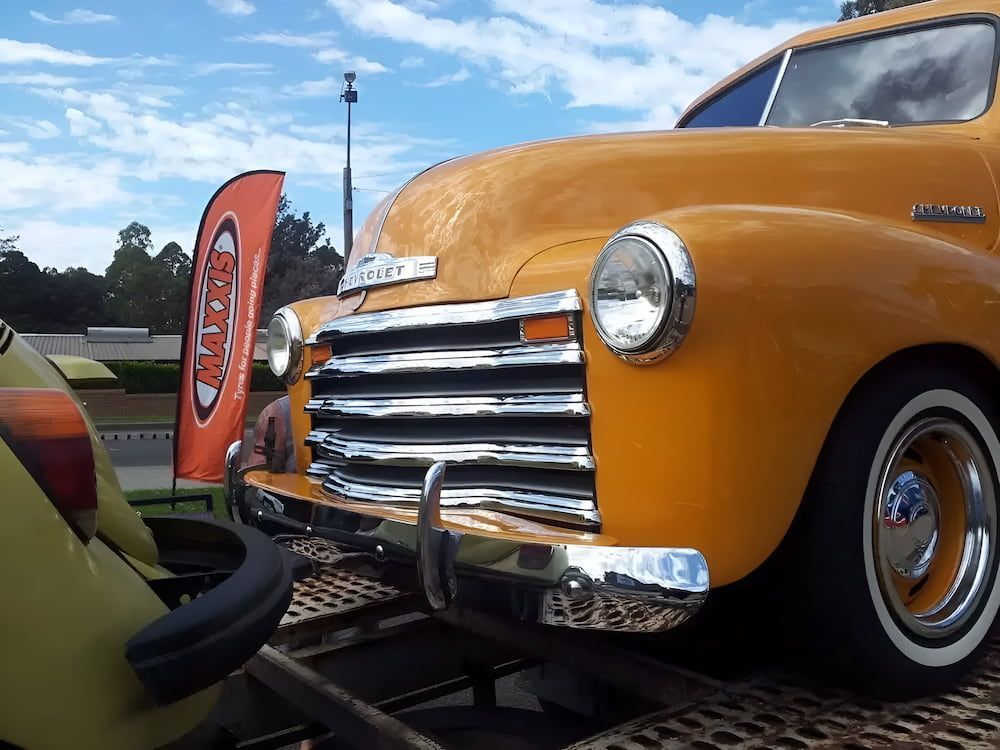 A Yellow Chevrolet Truck Is Parked On A Trailer — Figtree Brake and Clutch in Figtree, NSW