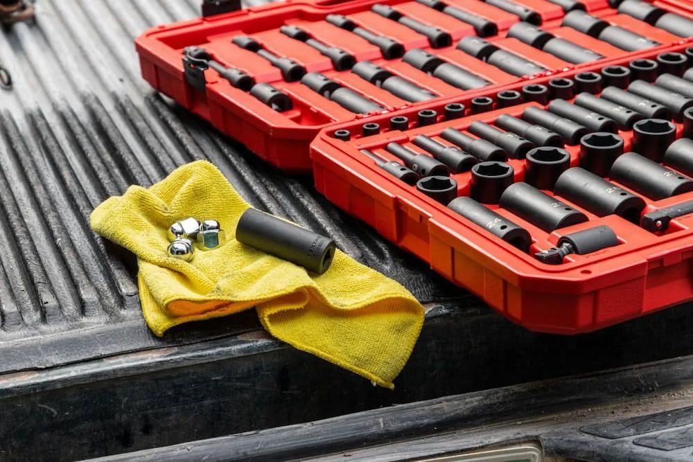 A Yellow Towel Is Laying On A Truck Bed Next To A Box Of Tools — Figtree Brake and Clutch in Figtree, NSW