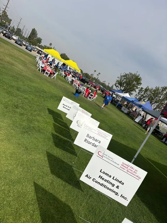Loma Linda Heat & Air sponsorship sign at the 2026 Redlands Hunger Walk