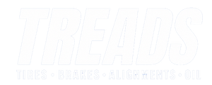 White logo with “FREEDS” and faint slogan “Tires Brakes Alignments Mufflers Oil”
