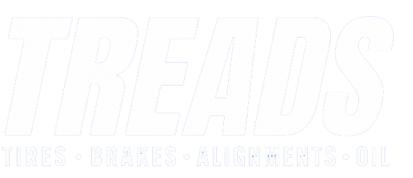 Faint white logo reading “TREADS” with the tagline “THINK • BRAKE • SHIFT • EVERY HILL” on a white background