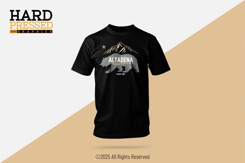 A black t-shirt featuring a mountain silhouette above a bear graphic with the word 